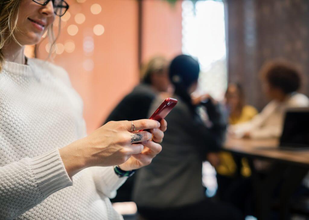 woman holding a phone picture